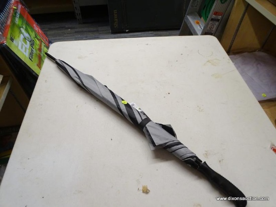 UMBRELLA; BLACK AND GRAY UMBRELLA. HANDLE IS DETACHING, JUST NEEDS TO BE REGLUED. MEASURES 3 FT 2 IN