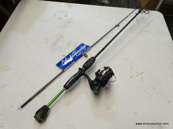 SHAKESPEARE FISHING ROD; UGLY STIK GX2 FISHING ROD WITH A GREEN AND BLACK COLORWAY. HAS DAMAGES