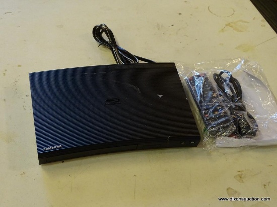 SAMSUNG BLU-RAY PLAYER; BLACK CURVED FRONT DVD PLAYER WITH CABLES, REMOTE, AND BATTERIES. NEW OUT OF
