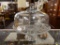 (R2) CAKE DISH; GLASS CAKE DISPLAY DISH WITH A PEDESTAL STAND AND A GLASS BOWL TOP. MEASURES 11.5 IN