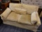 (R2) VINTAGE LOVESEAT; VINTAGE STATE OF NEWBURGH 2 CUSHION SOFA WITH A YELLOW FABRIC AND 2 THROW