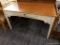 (R3) WOODEN DESK; LARGE WOOD GRAIN DESK WITH A WOODEN TABLE TOP AND A WHITE PAINTED DESK BELOW IT.