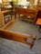 (R4) WOODEN BED FRAME; FULL SIZED JOHN VOGLER GROUP BED FRAME WITH A PANELED DETAILED HEAD AND
