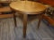 (R4) DRUM TABLE; OAK ROUND END TABLE WITH 1 LOWER SHELF. MEASURES 24 IN X 23 IN