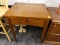 (R6) SINGER SEWING TABLE; FLIP TOP SINGER SEWING TABLE WITH A FOOT PEDAL. HAS 2 FAUX DRAWERS WITH