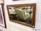 (R6) ANTIQUE FRAMED MIRROR; IN AN OAK FRAME AND IN VERY GOOD CONDITION. MEASURES 23 IN X 15 IN