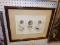 (R6) FRAMED PHOTO; A COLLAGE OF 3 PHOTOS OF A LITTLE CHILD. PLACED ON A BROWN MATTE AND FRAMED IN