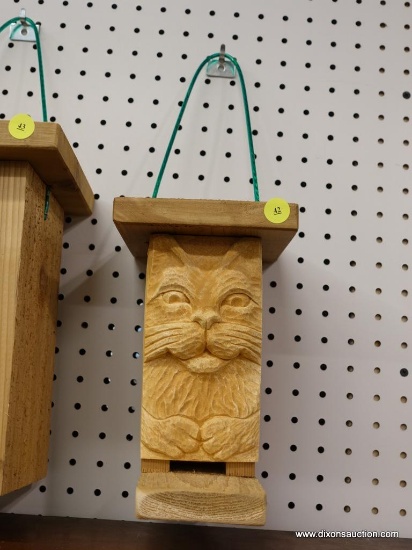 (R1) BIRD HOUSE; HANDMADE BIRD HOUSE WITH A CARVED CAT ON THE FRONT WITH SLOT ENTRY. MEASURES 5.5 IN