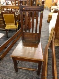 (R2) WOODEN CHAIR; VICTORIAN CARVED CHAIR WITH A BANNISTER BACK AND A LIFT UP SEAT WITH A STORAGE