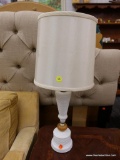 (R2) TABLE LAMP; MILK GLASS TABLE LAMP WITH A ROUND WOODEN KNOB IN THE MIDDLE OF IT AND A CREAM DRUM