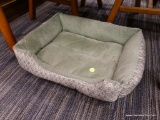 (R3) SMALL DOG BED; GREEN COLORED DOG BED WITH A SOFT INTERIOR AND A WHITE AND GREEN SPADE DESIGN ON