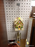 (R1) DECORATIVE CHIME; HANGING BIRDHOUSE WIND CHIME. MEASURES 1 FT TALL.