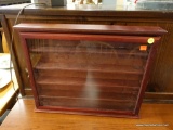 (R3) SHADOW BOX; WOODEN SHADOW BOX WITH A GLASS FRONT DOOR AND 4 SHELVES. MEASURES 20 IN X 3 IN X 16