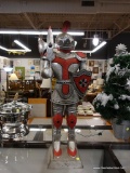 (R3) KNIGHT IN ARMOR STATUE; METAL STATUE OF A KNIGHT IN RED, GRAY, AND SILVER TONED ARMOR WITH A