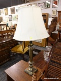 (R3) TABLE LAMP; BRONZE TONED AND BLACK TABLE LAMP WITH REEDED COLUMN BODY AND A CLOTH SHADE WITH