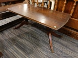 (R3) COFFEE TABLE; MAHOGANY COFFEE TABLE WITH A BRACKET DETAILED LIP AROUND THE TABLE TOP, BOW