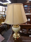 (R3) GLASS TABLE LAMP; CREAM AND GOLD TONE TABLE LAMP WITH TURNED DETAILING. COMES WITH A BEIGE BELL