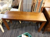 (R4) SOFA TABLE; WOODEN SOFA TABLE WITH 4 BLOCK LEGS. MEASURES 4 FT X 1 FT 3 IN X 2 FT 2 IN.