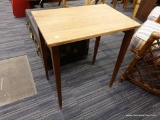 (R4) WOODEN SIDE TABLE; RECTANGULAR LIGHT COLORED WOODEN TOP SITTING ON 4 TAPERED MAHOGANY LEGS. TOP