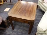 (R5) SIDE TABLE; WOODEN SIDE TABLE WITH REEDED DETAILING ALONG THE SIDES AND DOWN THE LEGS. MEASURES