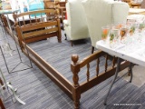 (R5) TWIN SIZE BED; WOODEN BED FRAME WITH TURNED POLE BANNISTER DETAILING ALONG THE FOOT AND