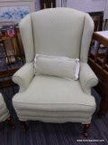 (R5) WINGBACK CHAIR; LIME GREEN WITH WHITE DOTS UPHOLSTERED WINGBACK ARMCHAIR WITH CABRIOLE FEET