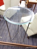 (R5) LAMP TABLE; GLASS TOP LAMP TABLE ON A TRIANGULAR METAL STAND. MEASURES 39.5 IN TALL WITH AN 18