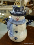 (R5) SNOWMAN COOKIE JAR; 10.5 IN TALL SNOWMAN COOKIE JAR WITH A BLUE COLORWAY. HAS AN 8 IN DIAMETER.