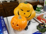 (R5) LIGHT UP PUMPKINS; PAIR OF PLASTIC PUMPKINS, ONE LARGER AND ONE SMALLER, WITH LIGHTS INSIDE OF