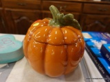 (R5) PUMPKIN CANDY JAR; PUMPKIN SHAPED GLOSS FINISHED CANDY JAR. MEASURES 9 IN TALL WITH AN 8 IN