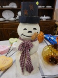 (R5) WOODEN SNOWMAN; HANDMADE AND PAINTED SNOWMAN MADE FROM A SOLID WOODEN BLOCK. MEASURES 23.5 IN