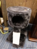 (R6) CAT TREE; BROWN CAT TREE WITH AN UPPER FLOOR AND 2 HANGING YARN BALLS. MEASURES 1 FT X 1 FT X