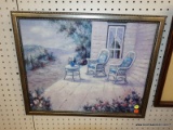 (R6) FRAMED PRINT; DEPICTS THE PORCH OF A COUNTRY HOME WITH 2 WOVEN ROCKING CHAIRS. FRAMED IN A