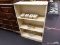 (R2) BOOKSHELF; WOODEN BOOKSHELF WITH A CREAM PAINT FINISH AND 3 SHELVES. MEASURES 23 IN X 9.5 IN X