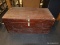 (R2) WOODEN CHEST; CHEST WITH A PADLOCK LATCH ON THE FRONT. MEASURES 2 FT 8 IN X 1 FT 4.75 IN X 1 FT