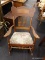 (R3) VINTAGE ROCKING CHAIR; COLONIAL REVIVAL WOODEN ROCKING CHAIR WITH AN UPHOLSTERED SEAT CUSHION