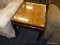 (R3) WOODEN END TABLE; WOODEN END TABLE WITH A PANELED WOOD DETAILING THAT HAS THE WOOD GRAINS