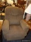 (R3) RECLINING ARM CHAIR; BROWN FABRIC ARMCHAIR THAT HAS A HANDLE FOR RECLINING ON THE RIGHT SIDE.