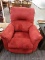 (R3) RECLINING ARM CHAIR; RED FABRIC RECLINING ARM CHAIR WITH A WOODEN HANDLE FOR RECLINING ON THE