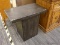 (R4) END TABLE; DARK PAINTED, T SHAPED WOODEN END TABLE. MEASURES 26 IN X 16 IN X 2 FT.