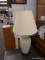 (R4) TABLE LAMP; GREEN CRACKLE POTTERY TABLE LAMP SITTING ON A BLACK PAINTED WOODEN STAND WITH A
