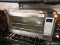 (R4) TOASTER OVER; OSTER TOASTER OVEN WITH STAINLESS STEEL FINISH AND 2 RACKS. MEASURES 21.5 IN X 14