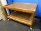 (BWALL) WOODGRAIN MICROWAVE/TV CART; RECTANGULAR ROLLING CART WITH LOWER SHELF. MEASURES 2 FT 3.5 IN