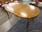 (R2) DINING ROOM TABLE; OVAL DINING ROOM TABLE WITH SCALLOPED EDGES AND GOLD TONE DETAILING AROUND