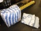 (TABLE) BAG LOT OF BED LINENS; LOT INCLUDES A BLUE AND WHITE STRIPED REVERSIBLE COMFORTER, AND A