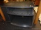 (R2) WOODEN ENTERTAINMENT STAND; BLACK SPECKLED ENTERTAINMENT STAND WITH A ROUNDED FRONT, A THIN