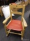 (R2) ROCKING CHAIR; SMALL ROCKING CHAIR WITH A RED LEATHER CUSHIONED BOTTOM. MEASURES 20 IN X 15 IN