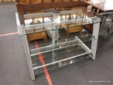 (R2) GLASS TV STAND; GLASS PANELED GRAY METAL TV STAND WITH 3 GLASS SHELVES. MEASURES 3 FT 5.5 IN X