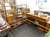 (R2) FULL SIZED BED; BRASS POLE FOOT AND HEAD BOARD WITH 2 SIDE RAILS. SITS ON CASTERS. MEASURES 81