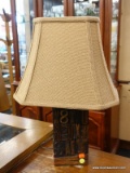 (R2) TABLE LAMP; WOODEN TABLE LAMP WITH RANDOM BLOCK LETTERS SCATTERED THROUGHOUT. COMES WITH A